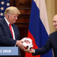 U.S. President Donald Trump, left, receives a soccer ball from Vladimir Putin, Russia’s president, during a news conference in Helsinki, Finland, on Monday, July 16, 2018. Trump called Special Counsel Robert Mueller’s probe into Russian election meddling a ‘disaster’ on Monday, again questioned whether Russia interfered in the 2016 election that he won and suggested he equally trusted his national intelligence director and Putin — all as he stood next to the Russian leader.